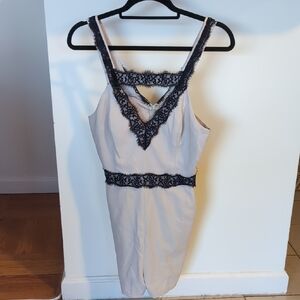 Elegant Beige Dress with Black Lace Trim